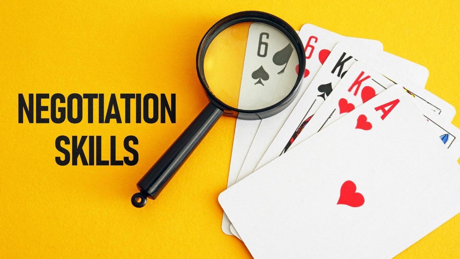 Gold selling negotiation skills illustrated with playing cards and a magnifying glass.